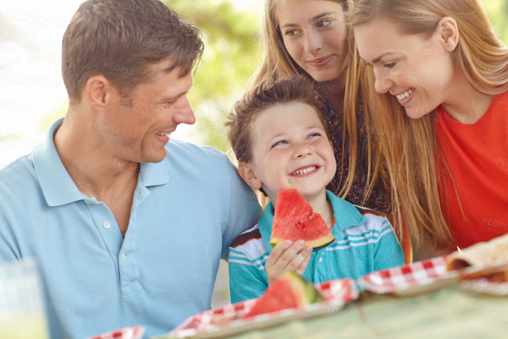 Buy stock photo Family, happy and excited in nature for picnic, fun activity and watermelon for refreshing snack. Parents, children and favorite fruit in park for relationship development on vacation in Australia