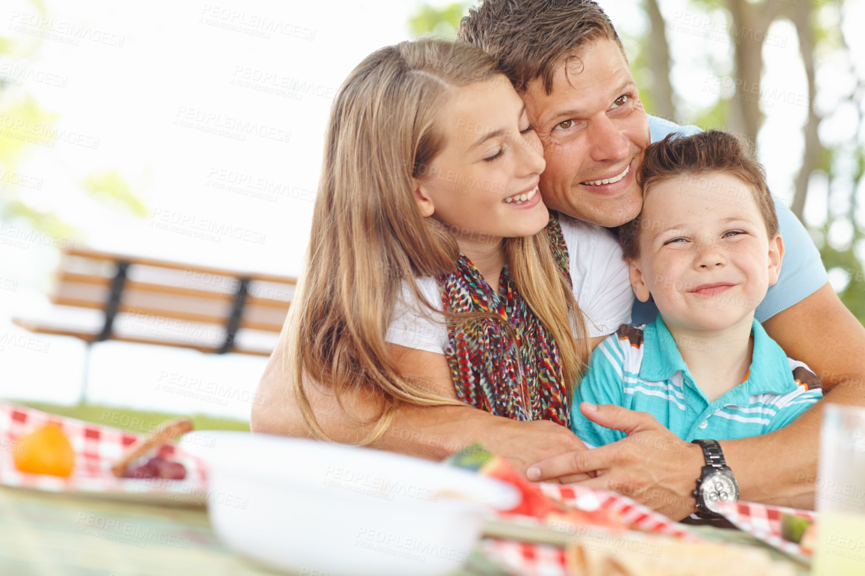 Buy stock photo Dad, kids and happy at park for picnic with food for bonding, trust and support in France. Parent, girl and boy with smile or excited in garden on break to relax, love and care for child development