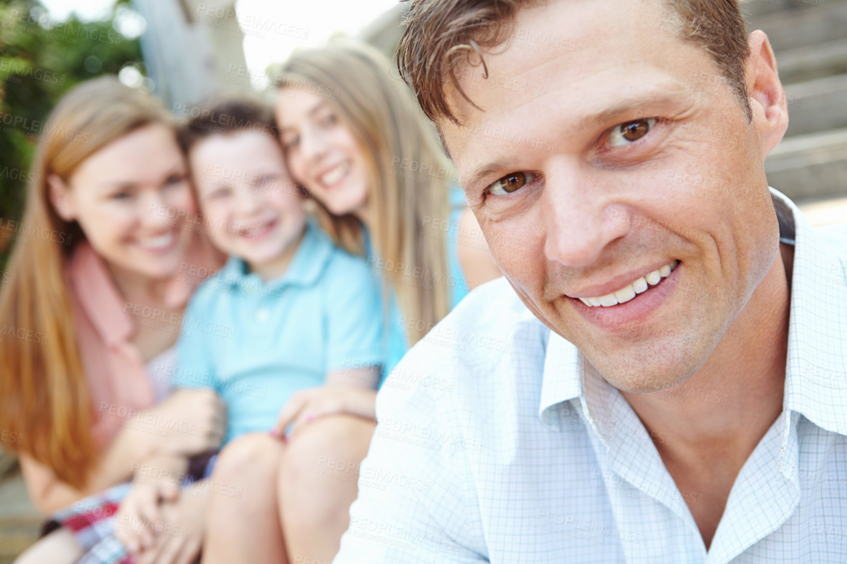 Buy stock photo Portrait, smile and father with family outdoor for summer vacation, relaxing and bonding together with love. Happy, man and holiday peace of travel with kids, woman and calm morning for weekend break