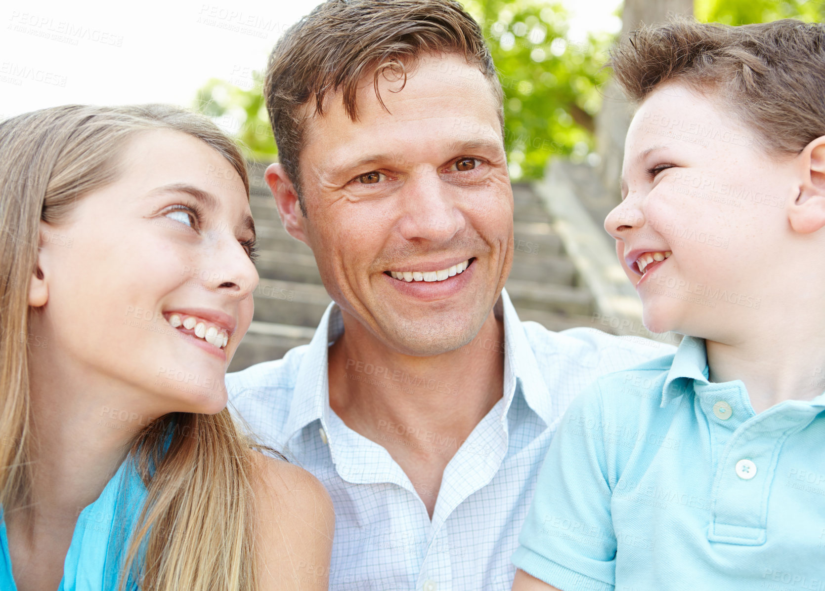 Buy stock photo Happy, man and children with love outdoor for summer vacation, relaxing and bonding together with trust. Smile, family and holiday peace of travel with kids, father and calm morning for weekend break