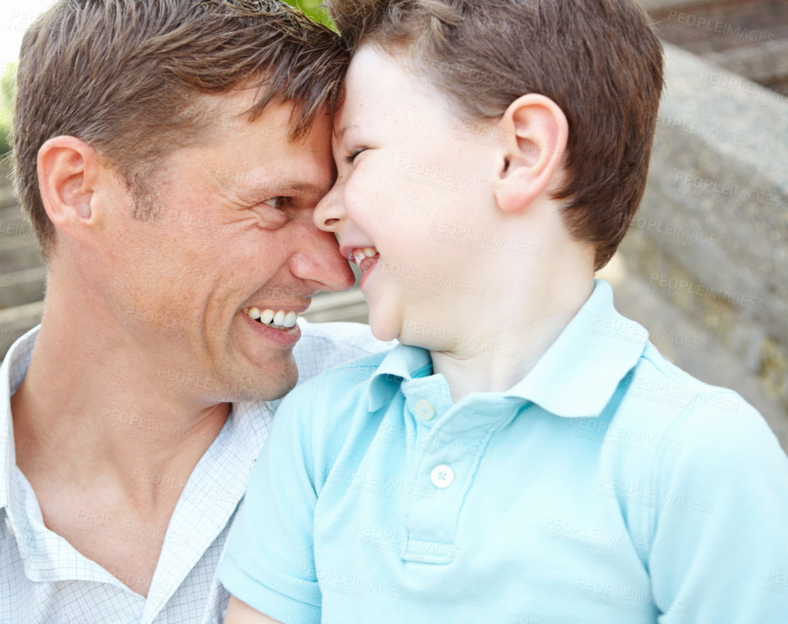 Buy stock photo Face, hug or laughing with father and son outdoor together for bonding, comedy or having fun. Happy, face or funny with single parent man and boy child joking or playing for comic or relationship