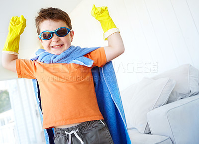 Buy stock photo Strong, kid and happy superhero in home to play fantasy game on halloween. Smile, cute boy and hero with power in costume to fight for justice, courage or flex muscle for creative cosplay in lounge