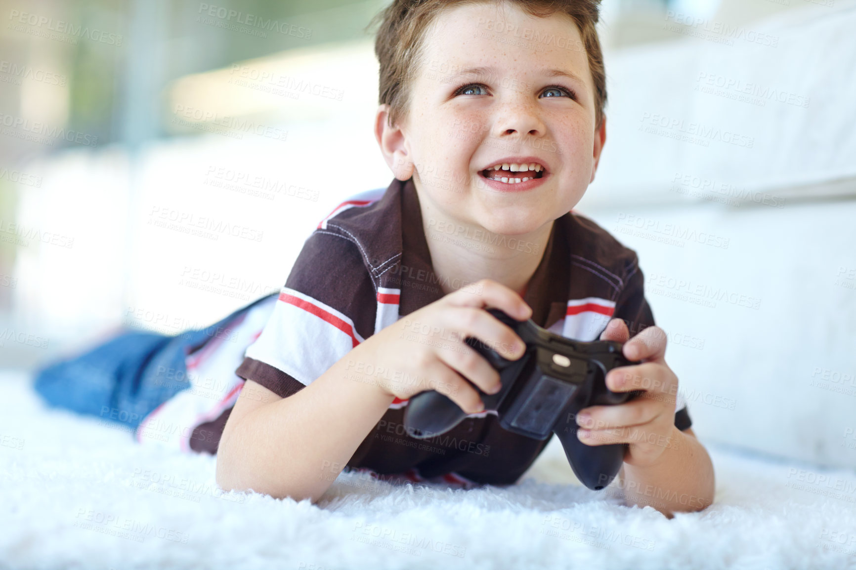 Buy stock photo Home, child and smile with controller for video game, playful and entertainment for childhood by carpet. Living room, happy boy and gamer with equipment for navigation, character action and challenge