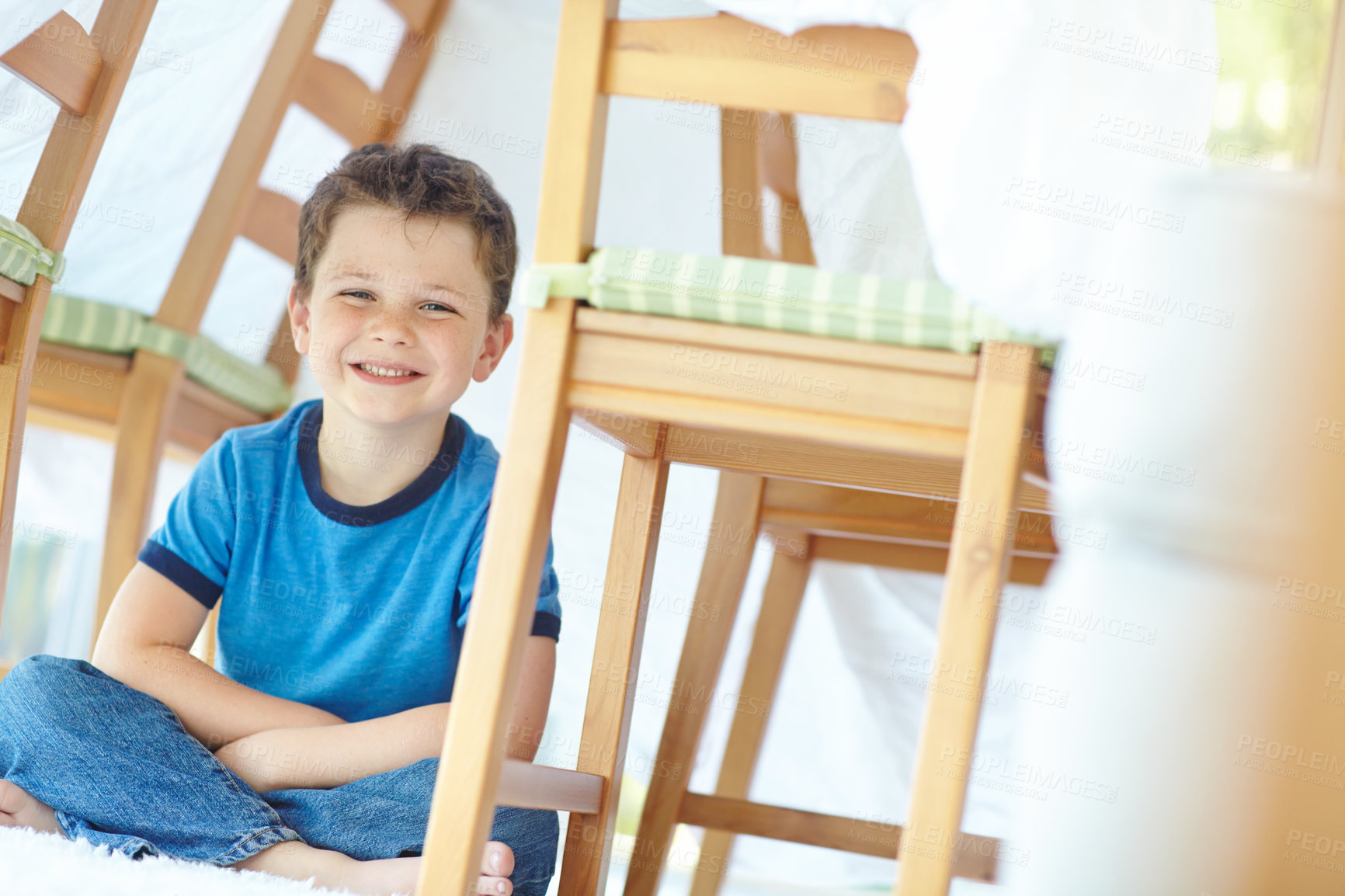 Buy stock photo Boy, child and fort in home portrait, playing hide and seek on floor of dining room. Male person, kid imagine and tent for fantasy games on carpet in France, healthy growth and development in house