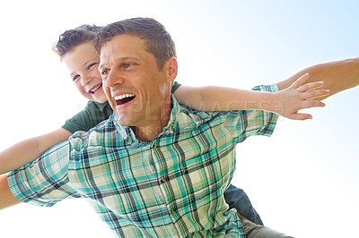 Buy stock photo Dad, boy and sky with fly on piggyback for fun, support and care at outdoor in France. People, parent and smile with kid as family on break to play with love, trust and child development or growth