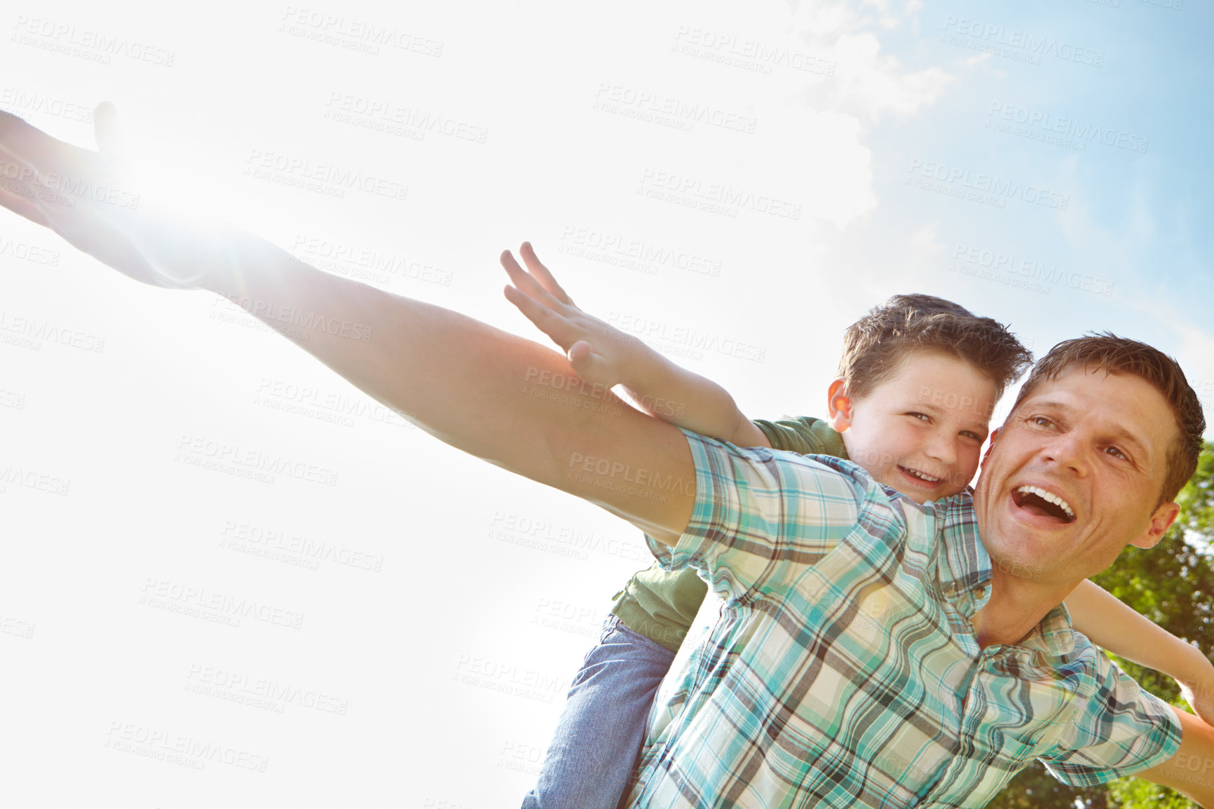 Buy stock photo Dad, son and sky with fly on piggyback for fun, support and care outdoor in France. People, parent and smile with kid as family on break to play with love, trust and child development or growth