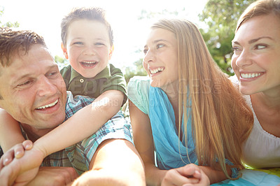 Buy stock photo Picnic, outdoor and portrait of family, nature and bonding with children, hug and parents in park. Embrace, mom and dad with kids, relax and break in weekend, happy and man with woman and together