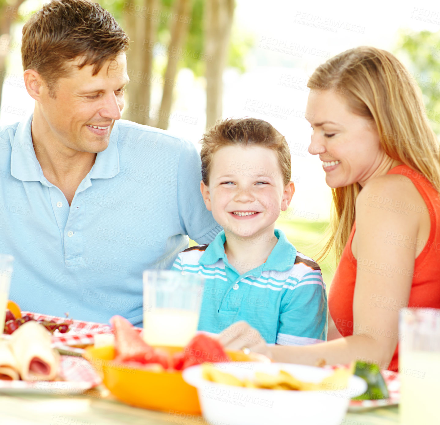 Buy stock photo Kid, happy family and parents at picnic with food for summer, vacation and thanksgiving party at park. Smile, lunch and people outdoor with mother, father and boy on holiday for celebration together