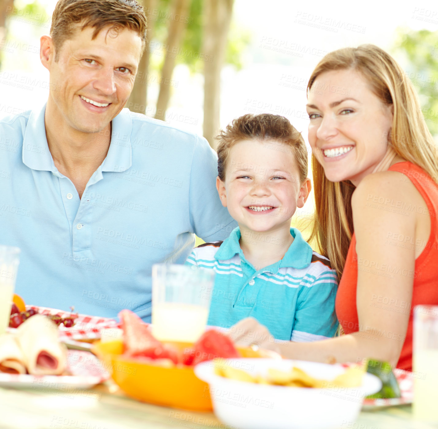 Buy stock photo Happy, picnic and portrait of family, outdoor and bonding in park, smile and nutrition for child. Vegan, mom and dad with kid, healthy food and break in weekend, woman and man with youth or vitamin c