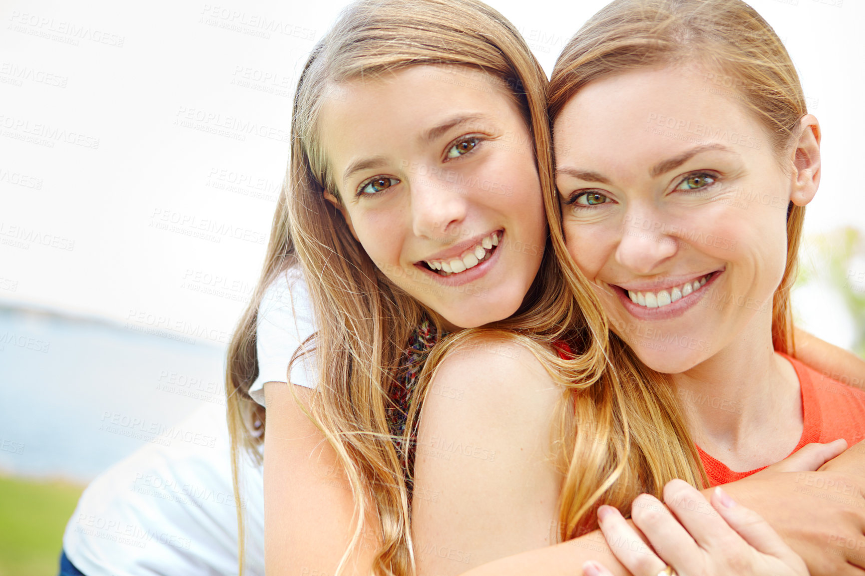 Buy stock photo Portrait, mother and girl with hug, outdoor and smile with happiness, bonding together and care. Face, family and single parent in park, mama, daughter and embrace with weekend break and nature