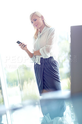 Buy stock photo Business woman, phone and reading in office with smile for notification, email or contact at company. Person, smartphone and scroll on mobile app for networking, chat and search at insurance agency