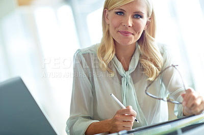 Buy stock photo Portrait, smile and writing with business woman at desk in office for administration or review. Laptop, notebook and planning with confident employee in professional workplace for online research