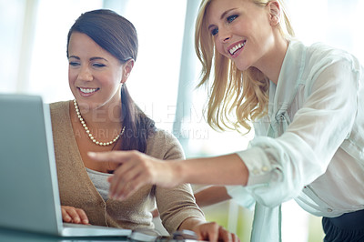 Buy stock photo Women, laptop and point with partner in office, reading and support for problem solving at company. Business people, teamwork and synergy for collaboration, stats and solution at insurance agency