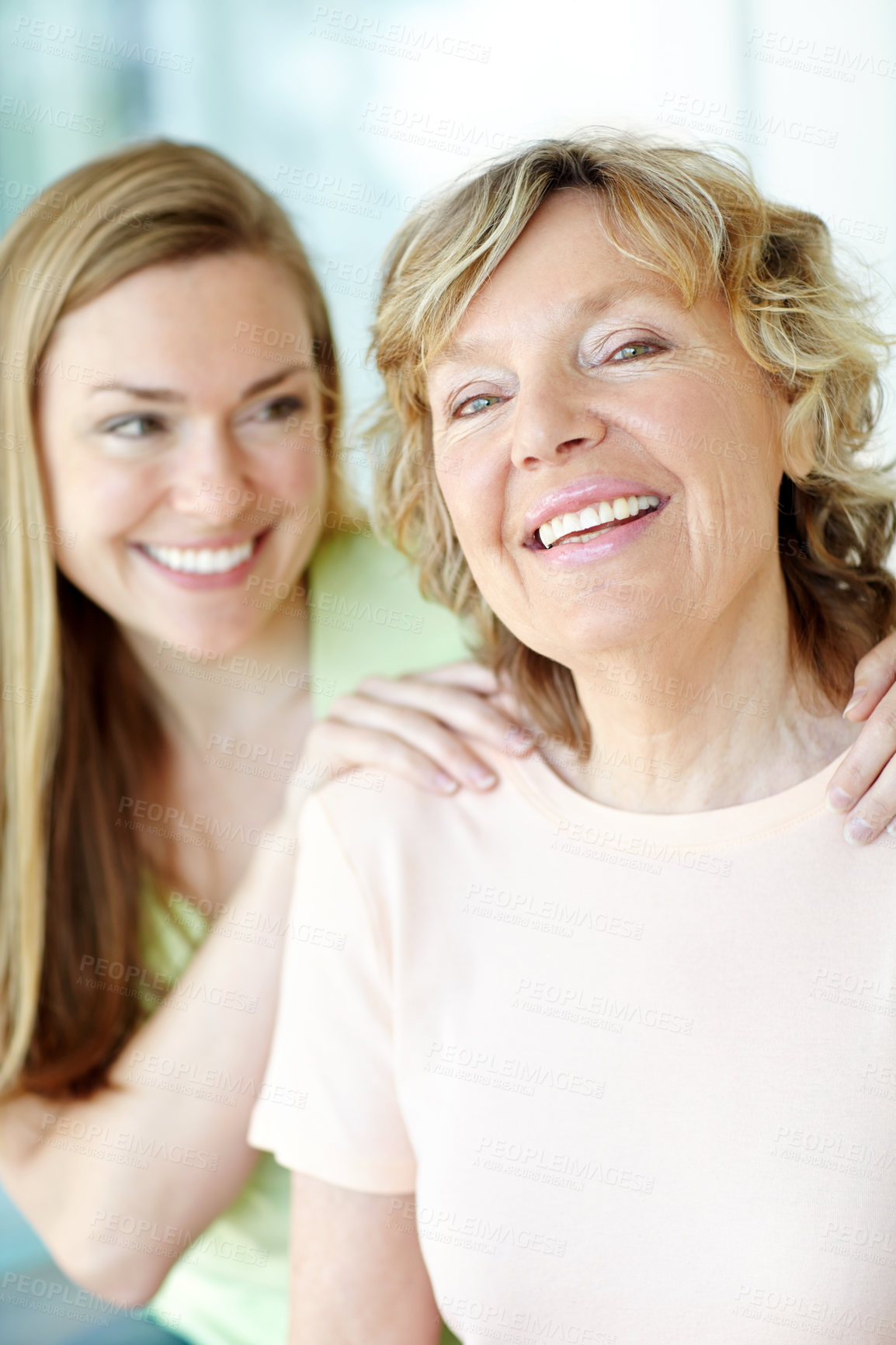 Buy stock photo Portrait, mature mother and daughter with smile, bonding and morning embrace in living room together. Relax, senior mom and girl with happy face for love, care and support in family home in Germany