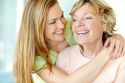 Buy stock photo Home, senior mother and woman with smile for hug, funny memory and bonding together with embrace. Happy people, mom and adult daughter with connection for family, relationship and laughing in house