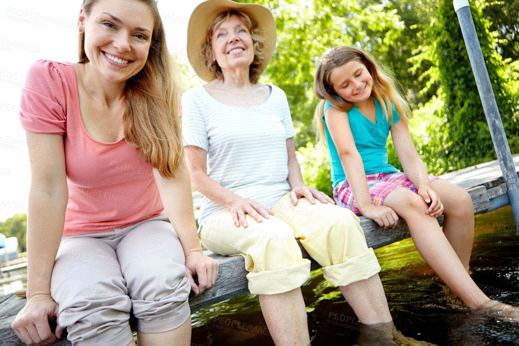 Buy stock photo Lake, happy family and senior parent for portrait with child, smile and relax on holiday or vacation. Grandmother, daughter and kid in bonding together for love, support or care as generations in USA