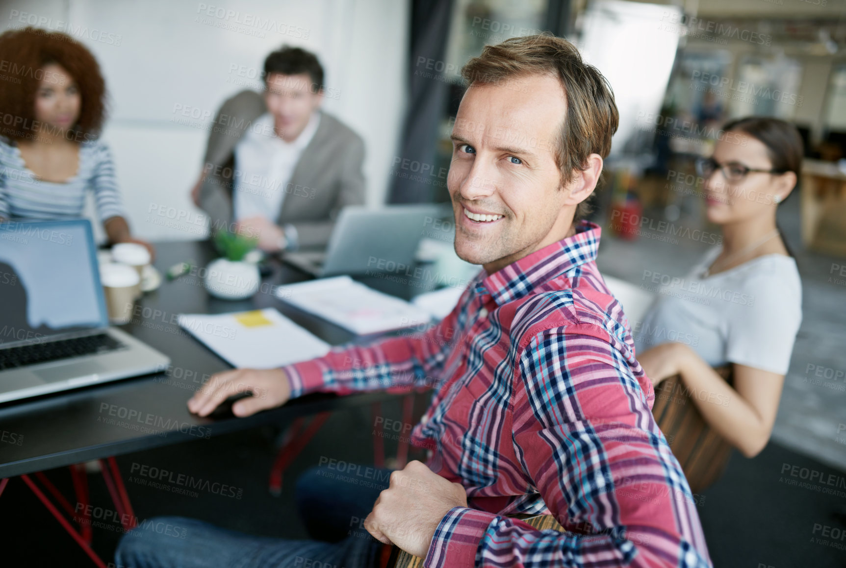 Buy stock photo Man, office and portrait with team at desk for meeting with strategy for political campaign with smile. Collaboration, working and laptop with plan for efficiency with workforce in Germany with pride