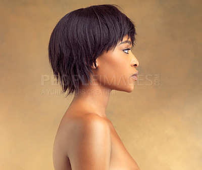 Buy stock photo African woman, beauty and profile in studio for skincare, cosmetics and hair style on brown or yellow background. Young model thinking of smooth foundation, dermatology and aesthetic or makeup idea