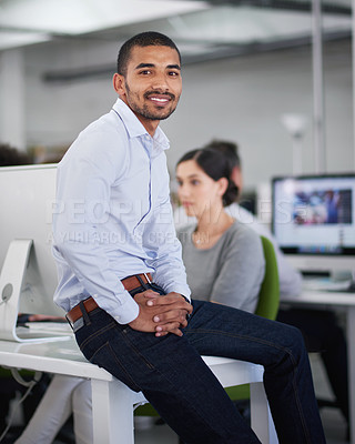 Buy stock photo Businessman, smile and portrait on desk in office with computers, colleagues and workplace. Sales, representative and male person in company for work, employee and corporate with tech and coworkers