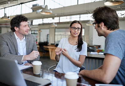 Buy stock photo Female editor, talking and coworkers in office space for company career or online planning in project with coffee.  Woman with male colleague and serious for discuss and feedback strategy on break