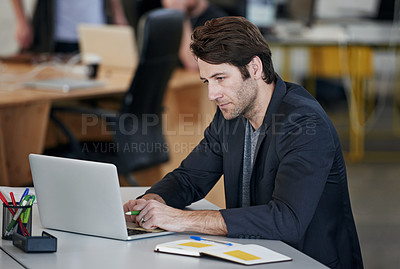 Buy stock photo Male person, laptop and working with notebook, stationary and desk in office for startup. Businessman, web and designer in workplace in company, business or corporate for tech, IT and online