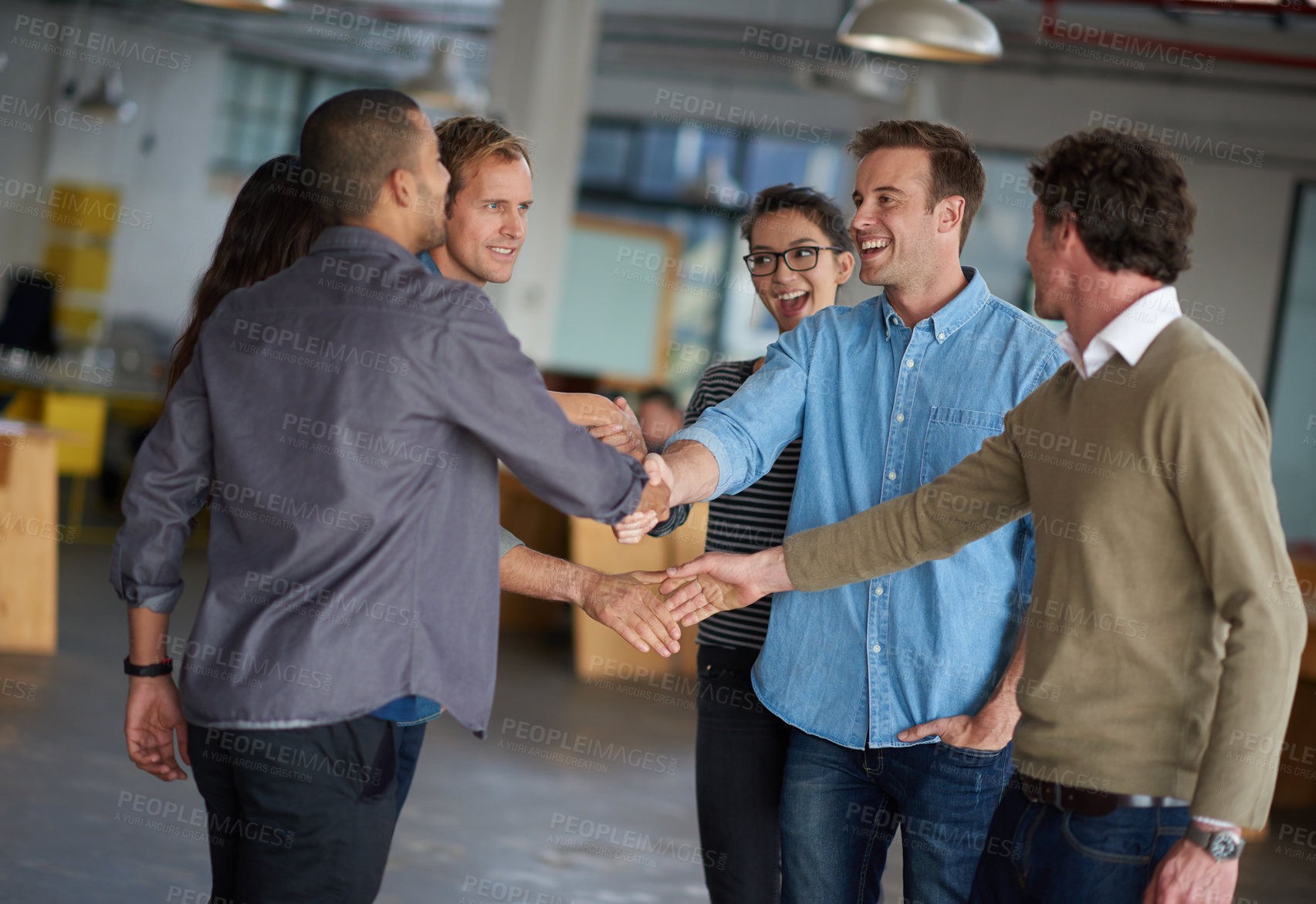 Buy stock photo Business people, handshake and group with meeting at startup for collaboration, b2b deal or agreement. Men, women and shaking hands with smile in scrum, kindness and respect at creative media agency