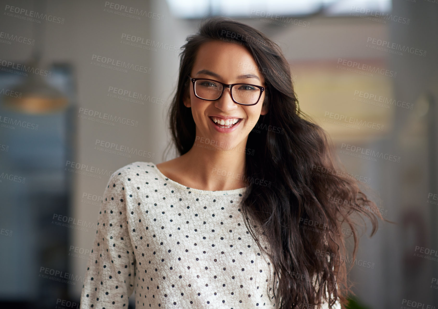 Buy stock photo Portrait of a trendy young woman smiling in an  industrial style office space