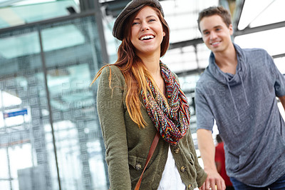 Buy stock photo Couple, smile and travel at train station for holiday, vacation or London journey. Man, woman and holding hands with love, romance and laugh at funny joke with transport and adventure or tourism