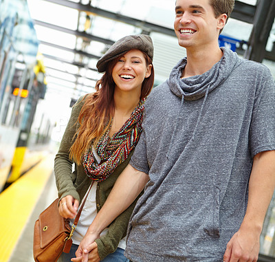 Buy stock photo Couple, vacation and journey at train station for holiday, journey or London adventure. Man, woman and holding hands with love, smile and honeymoon with public transport and travel or tourism