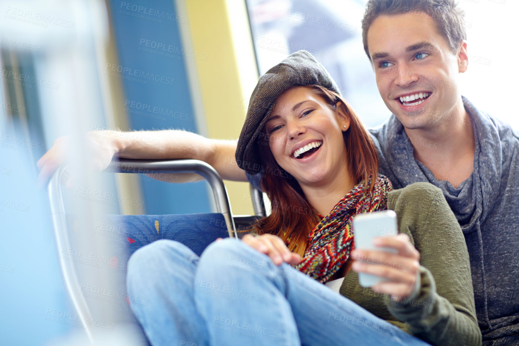 Buy stock photo Couple, smartphone and laughing on train for holiday, vacation or London honeymoon journey. Man, woman and online schedule for love, romance and happy with public transport and adventure or tourism