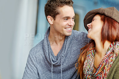 Buy stock photo Shot of a happy couple looking at each other lovingly with copyspace