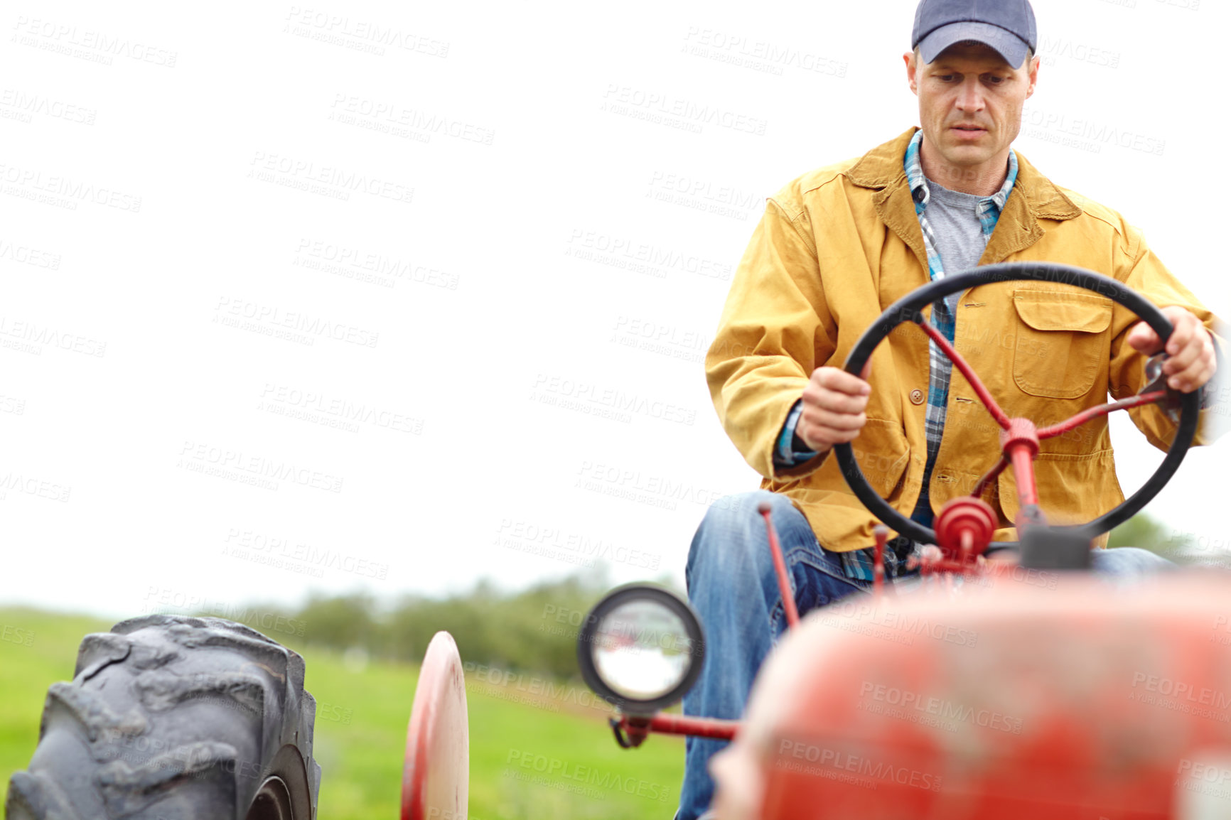 Buy stock photo Field, farming and man with tractor for driving, harvesting and tiling for cultivation in countryside. Mockup, male person or farmer with machine truck for agriculture, planting or plowing for growth