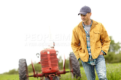 Buy stock photo Tractor, thinking and man on outdoor farm with confidence, agro industry or small business owner at harvest. Agriculture, sustainability and farmer in field with pride, grass and truck in countryside