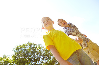 Buy stock photo Adventure, father and boy holding hands in garden for low angle fun, playing or family bonding in nature park. Mockup space, happy and son with single parent, dad and man in backyard for summer break