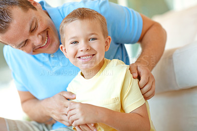 Buy stock photo Happy, father and child in family home with fun, bonding and love in living room. Smile, tickle and young boy with parent care, support and laugh from game with holiday and break on the floor