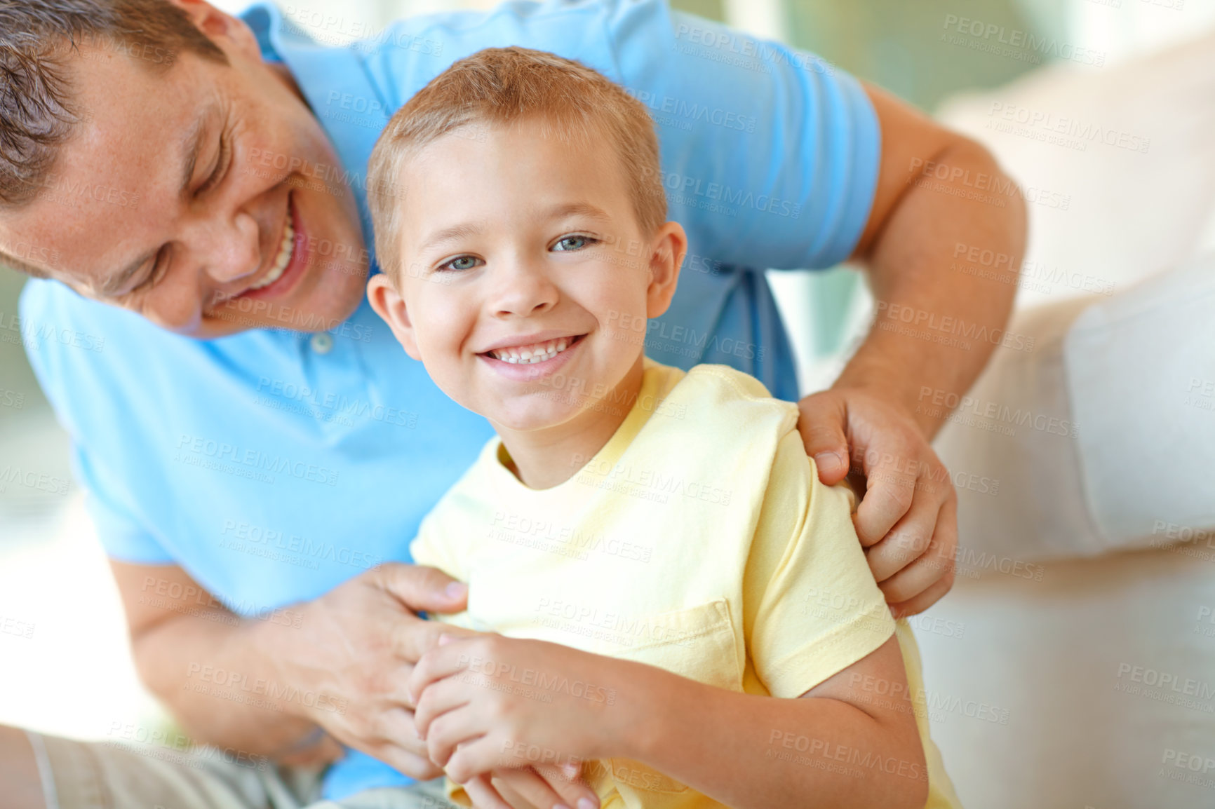 Buy stock photo Happy, father and child in family home with fun, bonding and love in living room. Smile, tickle and young boy with parent care, support and laugh from game with holiday and break on the floor