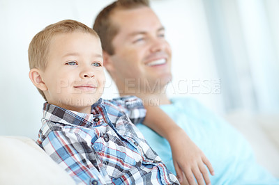 Buy stock photo Thinking, father and son relax at house for safety, bonding together and love of relationship care. Happy, man and child with calm morning, weekend break and family support for embracing at apartment