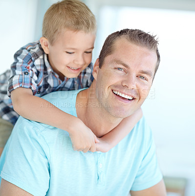 Buy stock photo Boy, father and piggy back on sofa in home for portrait, bonding or love for games, funny or connection in lounge. Child, dad and happy man with comic memory, hug or relax at family house in Germany