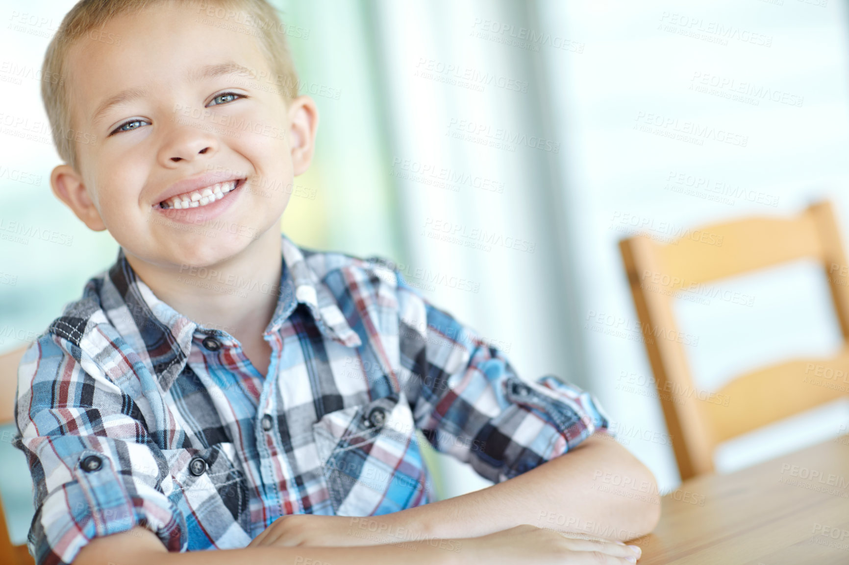 Buy stock photo Portrait, smile and child in home, cute and happy for break, table and adorable boy in morning and relax. Joy, youth and kid in kitchen, confident and chilling in apartment, expression and weekend