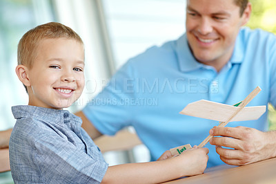 Buy stock photo Airplane, building and portrait of dad with child with toys for bonding, relationship and creativity. Family, happy and father with boy for model aeroplane for games, entertainment and relax in home