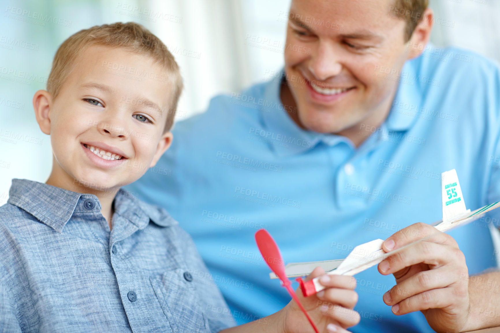 Buy stock photo Airplane, model and portrait of dad with child with toys for bonding, relationship and creativity. Family, happy and father with boy building aeroplane for games, entertainment and relax in home