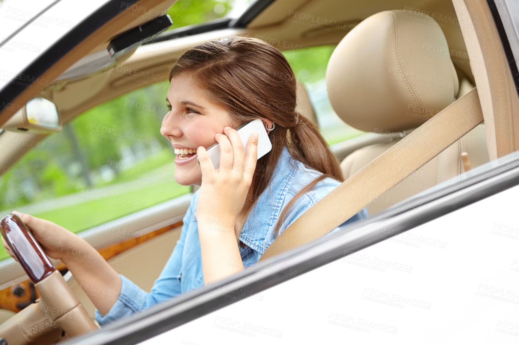 Buy stock photo Happy woman, car and window with phone call for drive, destination or commute in neighborhood. Young, female person or driver with smile on mobile smartphone for conversation or chat in motor vehicle