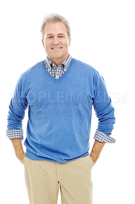 Buy stock photo Studio portrait of an attractive man in his 40's standing with hands in pockets and smiling