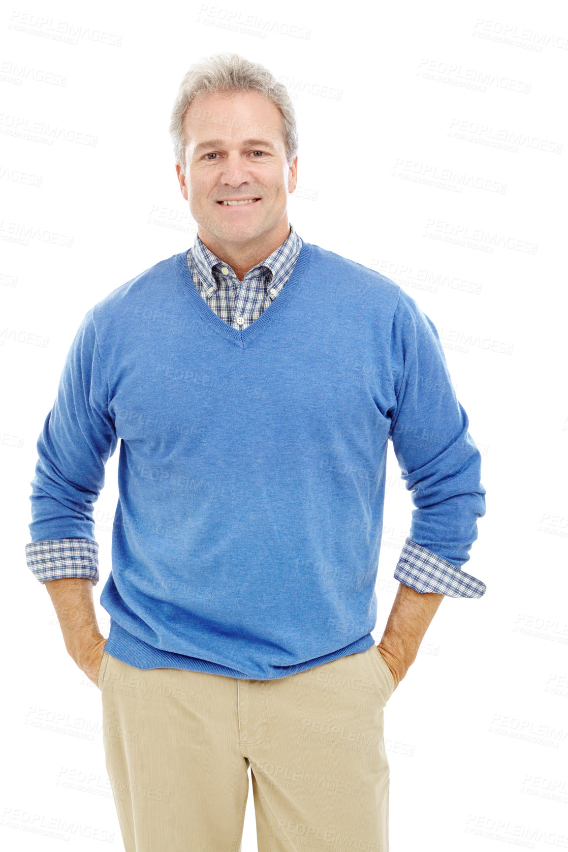 Buy stock photo Studio portrait of an attractive man in his 40's standing with hands in pockets and smiling