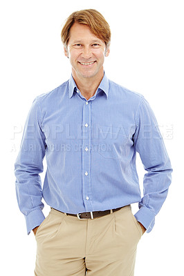 Buy stock photo Cropped sudio shot of a mature, attractive male standing with his hands in his pockets and smiling widely