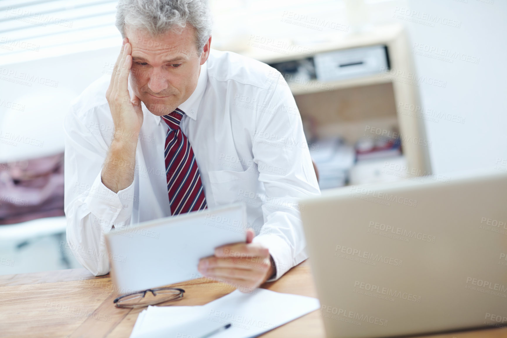 Buy stock photo Mature, businessman and stress with tablet for debt, financial crisis or bad news at office. Senior, man or employee with migraine or vertigo on technology for bankruptcy or mistake at workplace