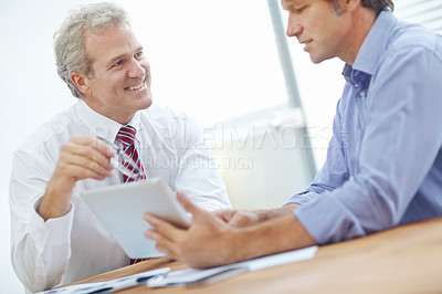 Buy stock photo Two businessmen having a positive meeting in the office