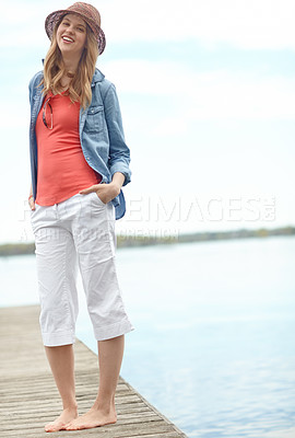 Buy stock photo Holiday, fashion and portrait of woman on dock with smile, relax and outdoor adventure in nature. Pier, lake and happy girl on travel vacation with casual style, confidence and calm morning in Canada