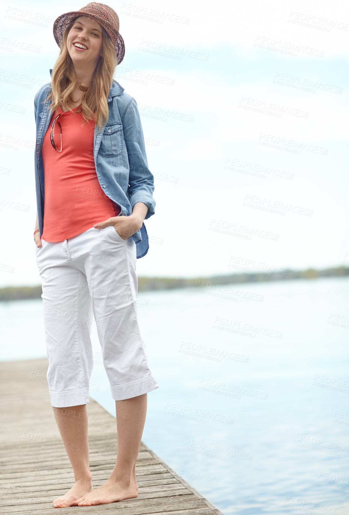 Buy stock photo Holiday, fashion and portrait of woman on dock with smile, relax and outdoor adventure in nature. Pier, lake and happy girl on travel vacation with casual style, confidence and calm morning in Canada