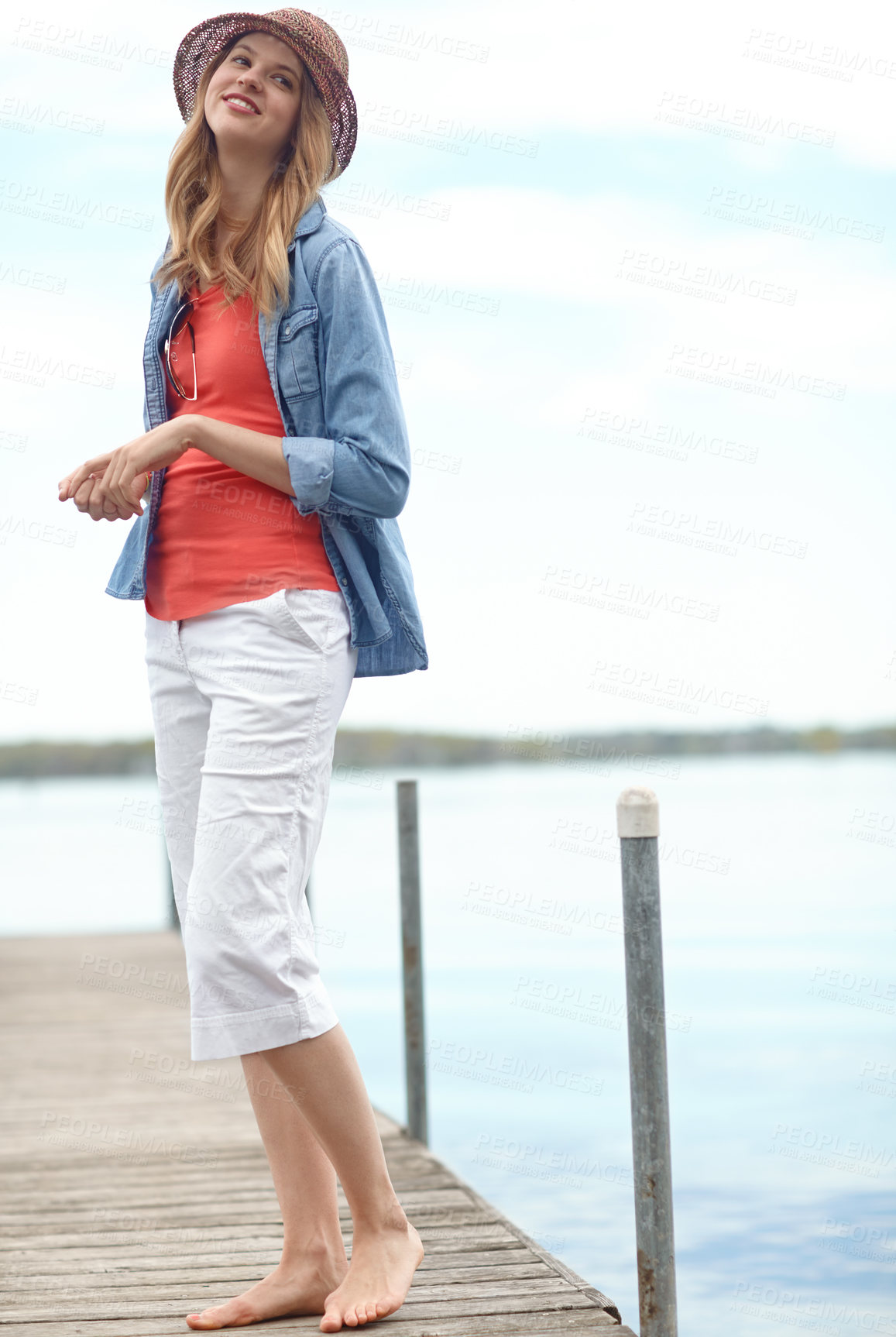 Buy stock photo Holiday, fashion and woman on pier with smile, relax and outdoor adventure in nature. Dock, lake and happy girl on travel vacation with casual style, confidence and calm weekend morning in Canada